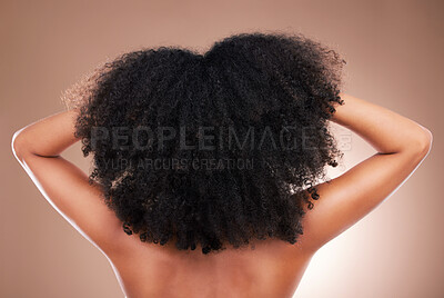 Buy stock photo Hair, black woman with afro and beauty, haircare and natural cosmetics, back on studio background. Female, cosmetic treatment with curly hairstyle, rear view and texture, person arms with grooming