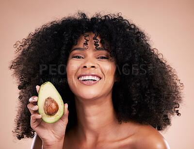 Buy stock photo Black woman, studio portrait and avocado with smile, skincare and health with self care  wellness by background. Happy gen z model, African and fruit for natural cosmetics, healthy nutrition or diet