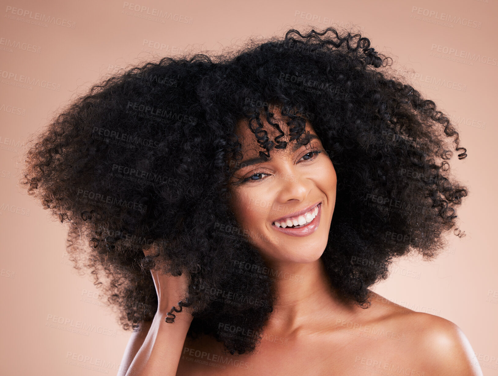 Buy stock photo Hair care, black woman and curly texture of a young model with a healthy afro from salon treatment. Happy face, cosmetics and African person with wellness, skincare and smile from beauty in studio