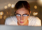 Business woman, face and reading on computer, focus and working, editor and research with bokeh overlay. Female in office, data analysis and check article for blog or read email, review for feedback