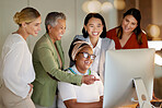 Teamwork, management and a business woman with her team, working on a computer in the office while laughing. Collaboration, diversity or coaching with a senior female manager training staff at work