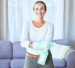 Woman in portrait, cleaning and chemical spray to clean apartment, cleaner and happy with housekeeping. Female housekeeper, gloves for safety from bacteria and bottle, hygiene product and house work