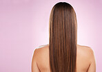 Hair, beauty and woman with back and haircare, mockup space and keratin treatment on pink background. Cosmetics shine, grooming and hairstyle, dandruff free and cosmetic care with female rear view