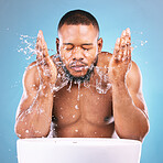 Water splash, hands or black man with face wash for skincare, fresh clean hygiene on studio background. African male model in beauty, wellness and washing, grooming  or cleansing for facial treatment