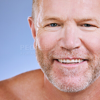 Buy stock photo Skincare zoom, smile and portrait of a mature man in a blue background studio with mockup. Facial, cosmetics wellness and spa treatment of a senior model with happiness from self care cleaning