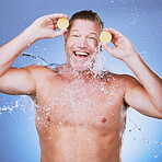 Lemon in hands, water splash and happy man in portrait, beauty and skincare, eco friendly and organic on blue background. Hydration, vitamin c and face care with senior male, skin and citrus fruit