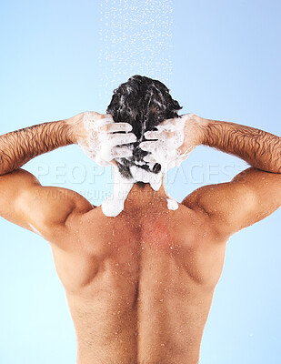 Buy stock photo Shower, cleaning hair and back of man with shampoo, conditioner and water soap for wellness. Self care, bathroom hygiene and male with foam, grooming products and washing body on blue background