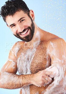 Buy stock photo Shower, cleaning and portrait of man with soap, smile and water splash for wellness, hygiene and grooming. Skincare, health and male face with foam, cosmetics and washing body on blue background 