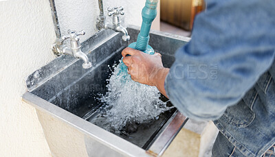 Buy stock photo Plumber, water and man with plunger for kitchen sink, maintenance and repairs, blockage or cleaning. Plumbing, drain and professional handyman fixing, clear and working with equipment for system fix