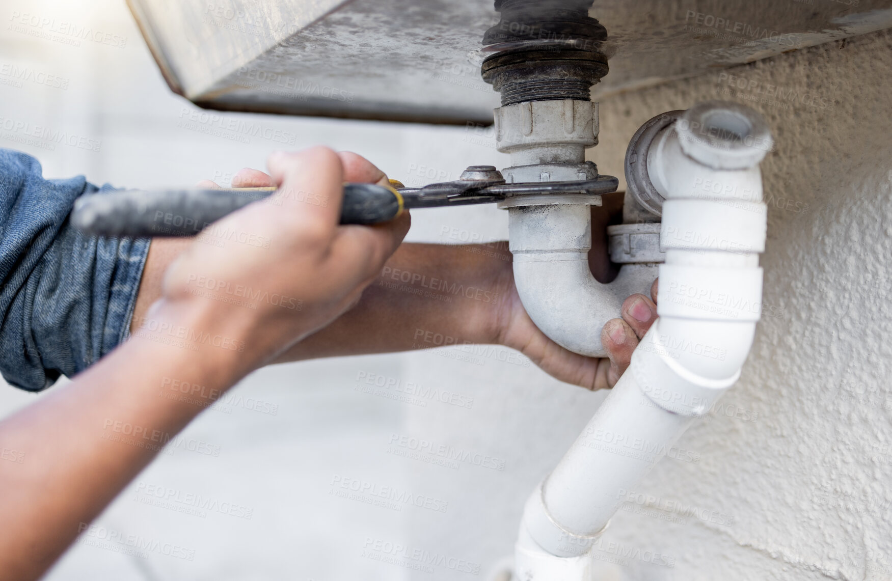 Buy stock photo Hands, tool and pipe with a man plumber fixing a water system as a DIY handyman for maintenance. Building, construction or plumbing with a professional contractor working to install pipeline drainage