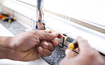 Plumbing man, faucet and hands with screw for building maintenance, renovation and service. Closeup handyman, tap and plumber tools of engineering contractor, upgrade pipeline system or mechanic work