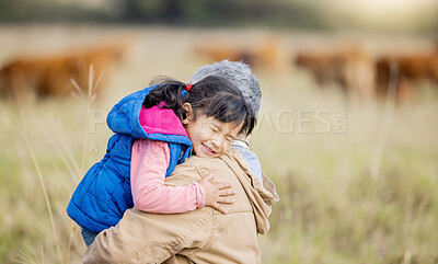 Buy stock photo Grandmother, happy hug and girl on nature walk with senior woman in the countryside. Outdoor field, grass and elderly female with child on a family adventure on vacation with happiness and fun 