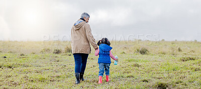 Buy stock photo Back, love and grandmother with girl, countryside and bonding together, happiness and loving. Family, granny and granddaughter in nature, morning and walking for fresh air, balance and affection