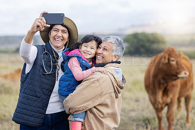 Buy stock photo Farm, agriculture and selfie of parents and girl in countryside for holiday, vacation and adventure on field. Lesbian couple, family adoption and photo of child with mom for quality time on cow ranch