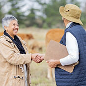 Farm, handshake and teamwork with a woman in agriculture saying thank ...