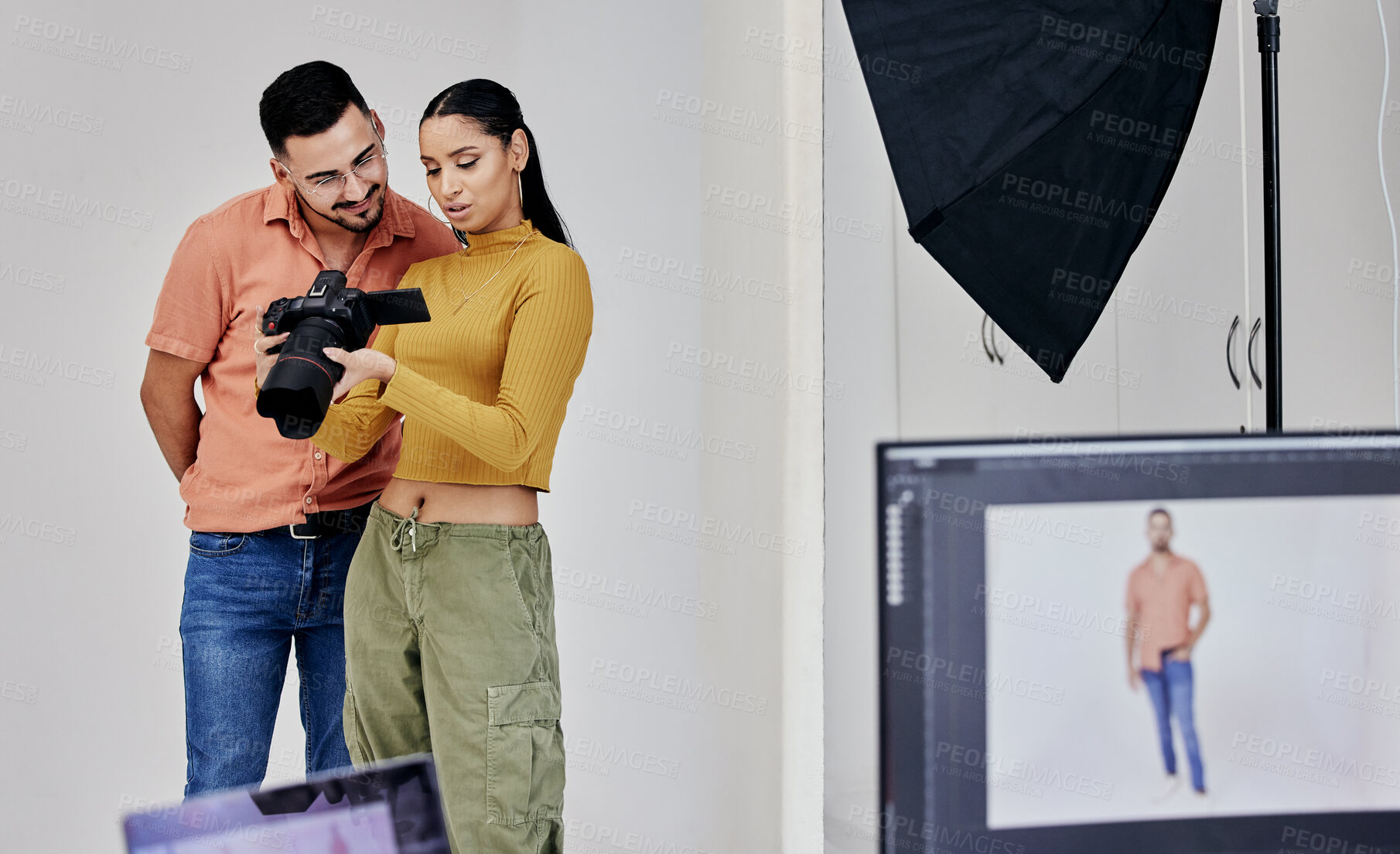 Buy stock photo Teamwork, photographer and startup people with camera in studio set for shoot, magazine project or online content. Planning, focus or girl examine picture for digital catalog or fashion web design