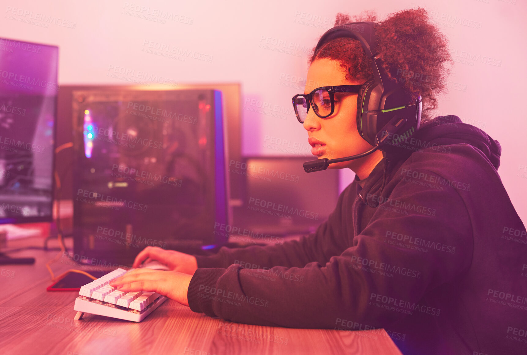 Buy stock photo Video game, young girl and headphones in home for esports, online games and virtual competition. Female gamer, computer live streaming and gaming with headset in neon lighting, tech or gen z streamer