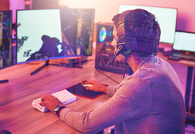 Buy stock photo Computer gaming, man and headphones for esports, online games or virtual competition in dark room. Gamer guy, digital player and live streaming on headset in neon lighting, technology or rpg streamer