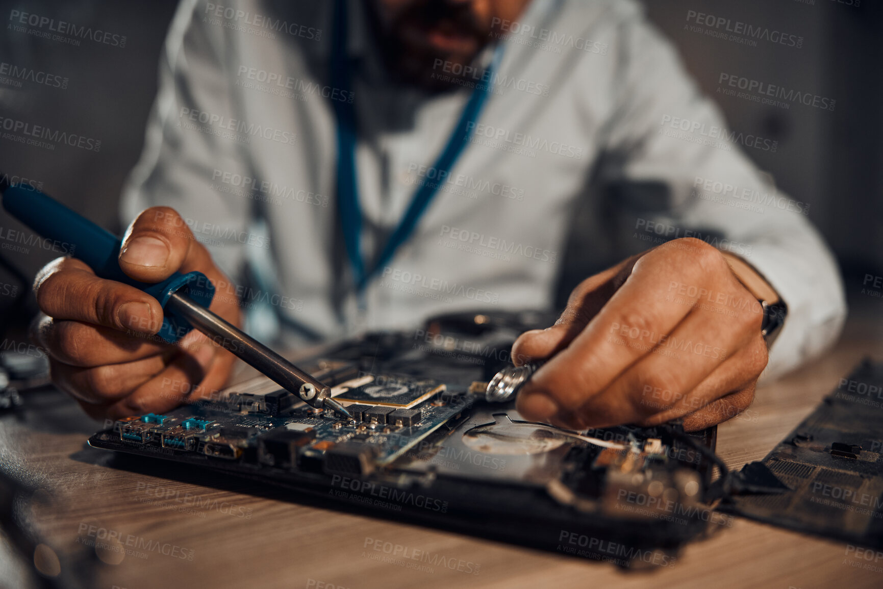 Buy stock photo Man hands, it or soldering motherboard in engineering workshop for night database fixing. Zoom, technician or circuit board tools in repair, maintenance or upgrade in information technology industry