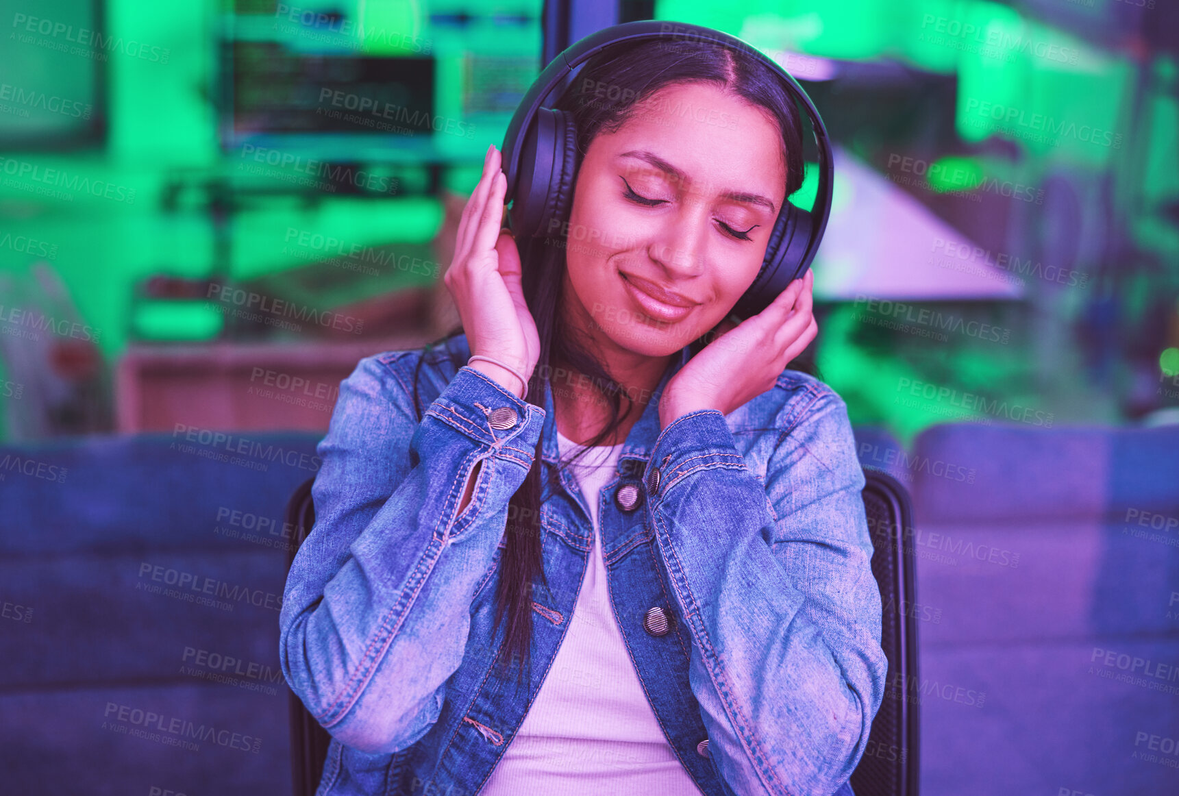 Buy stock photo Music headphones, relax and woman in home streaming radio or podcast at night in green neon light. Hacker, it programmer and happy female coder listening and enjoying song, audio or sound in house.