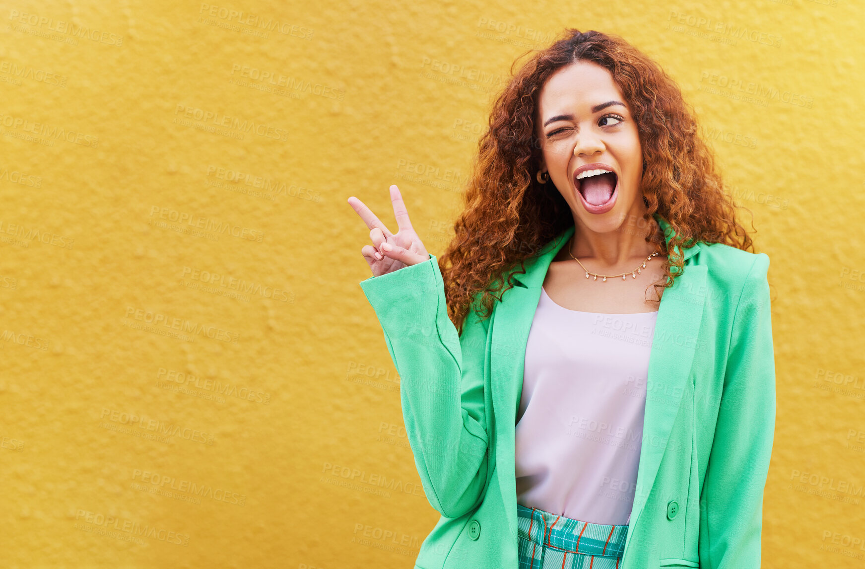 Buy stock photo Woman, peace and wink on yellow background, color backdrop and mockup space. Happy female, v sign and hands of cool model for victory, winking and fun mood with happiness, mock up and gen z fashion