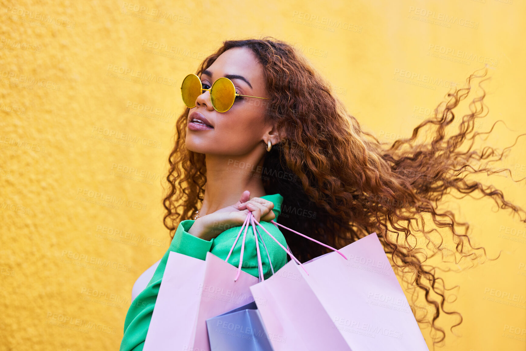 Buy stock photo Wealth, posh and portrait of a woman with shopping bags for fashion, luxury sale and discount. Elegant, retail and rich girl in the city to shop, buying clothes and fashionable clothing on a wall