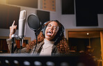 Music, singing and radio with a black woman celebrity at her record label to sing a song for her new album. Creative, art and performance with a female singer streaming live in a recording studio