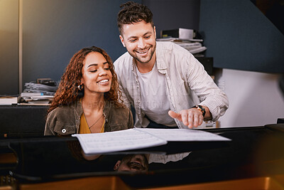 Buy stock photo Artists, piano and people playing music in a creative or recording studio with a song book. Art, musicians and couple in production writing of album or sound track together with a musical instrument.