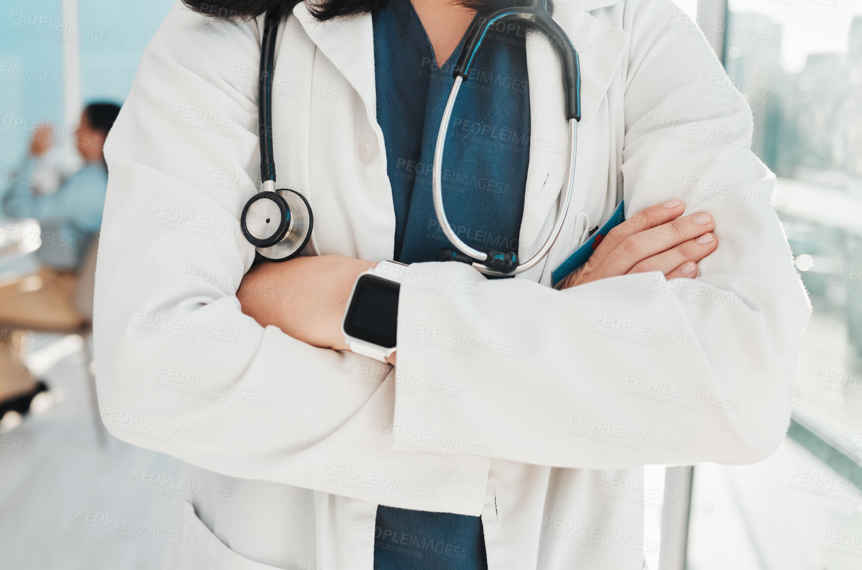 Buy stock photo Doctor, hands and arms crossed with stethoscope for healthcare cardiology or life insurance at hospital. Closeup hand of confident medical expert, professional or specialist standing ready at clinic