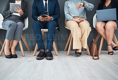 Buy stock photo Legs, recruitment and business people in waiting room for interview with human resources. Hr hiring, job opportunity and group of candidates, men and women with devices in company for employment.