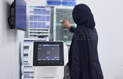 Buy stock photo Optometry, screen for eye exam and Muslim optician with machine for vision test, eyesight and optical assessment. Healthcare, ophthalmology and optometrist working on medical camera for eyes scan