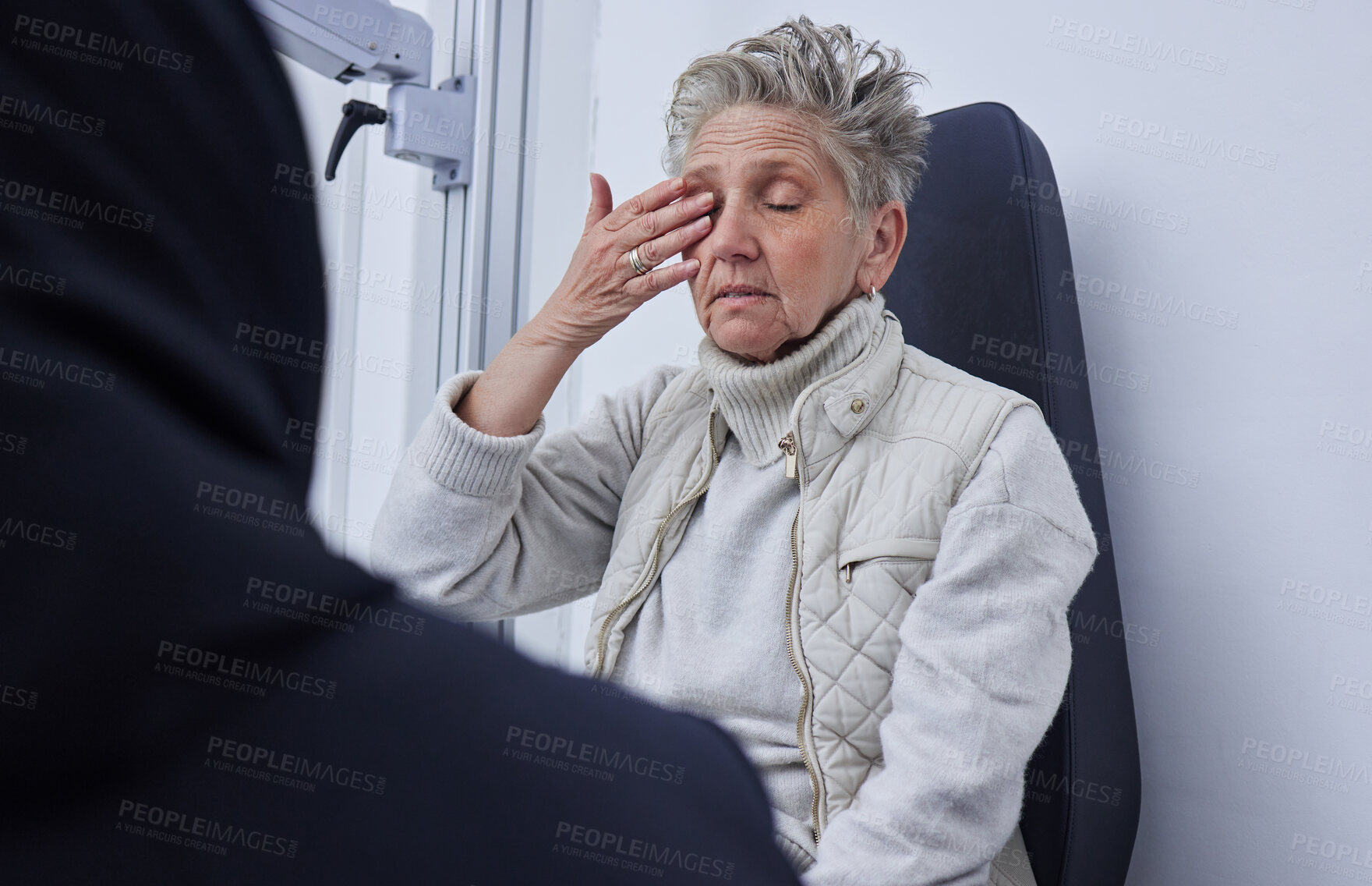 Buy stock photo Senior woman, ophthalmology and eye pain with hand in clinic consultation for vision, wellness or health. Elderly patient, explain problem and talk with doctor for eyes, headache or medical solution