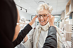 Glasses, vision and optometry with a senior woman in an optician office for prescription lenses. Eyewear, eyesight and fashion with a mature customer buying new frame spectacles at the optometrist