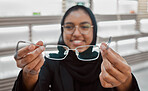 Decision, portrait and Muslim woman with glasses for vision, help and shopping at a store. Optometry, retail and Islamic optician helping with eyewear fitting, consultation and eye care frame