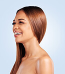 Face, skincare and hair care of woman in studio isolated on a blue background. Makeup cosmetics, thinking beauty and laughing funny female model with salon treatment for growth, texture and balayage.