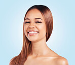 Portrait, skincare and hair with a model black woman in studio on a blue background for natural haircare. Face, beauty and keratin with an attractive young female feeling proud of her hairstyle