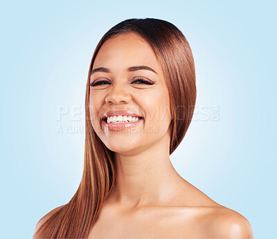 Buy stock photo Portrait, skincare and hair with a model black woman in studio on a blue background for natural haircare. Face, beauty and keratin with an attractive young female feeling proud of her hairstyle