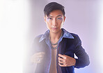 Makeup, light and portrait of gay man from Indonesia with confidence isolated on purple background. Style, aesthetic and lgbt fashion model with beauty in studio, non binary and gender neutral design