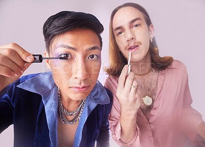 Man, gay and mascara makeup in studio with gen z friends, beauty and cosmetics for fashion by background. Lgbtq couple, cosmetic or portrait for vintage 80s aesthetic with support, solidarity or eyes