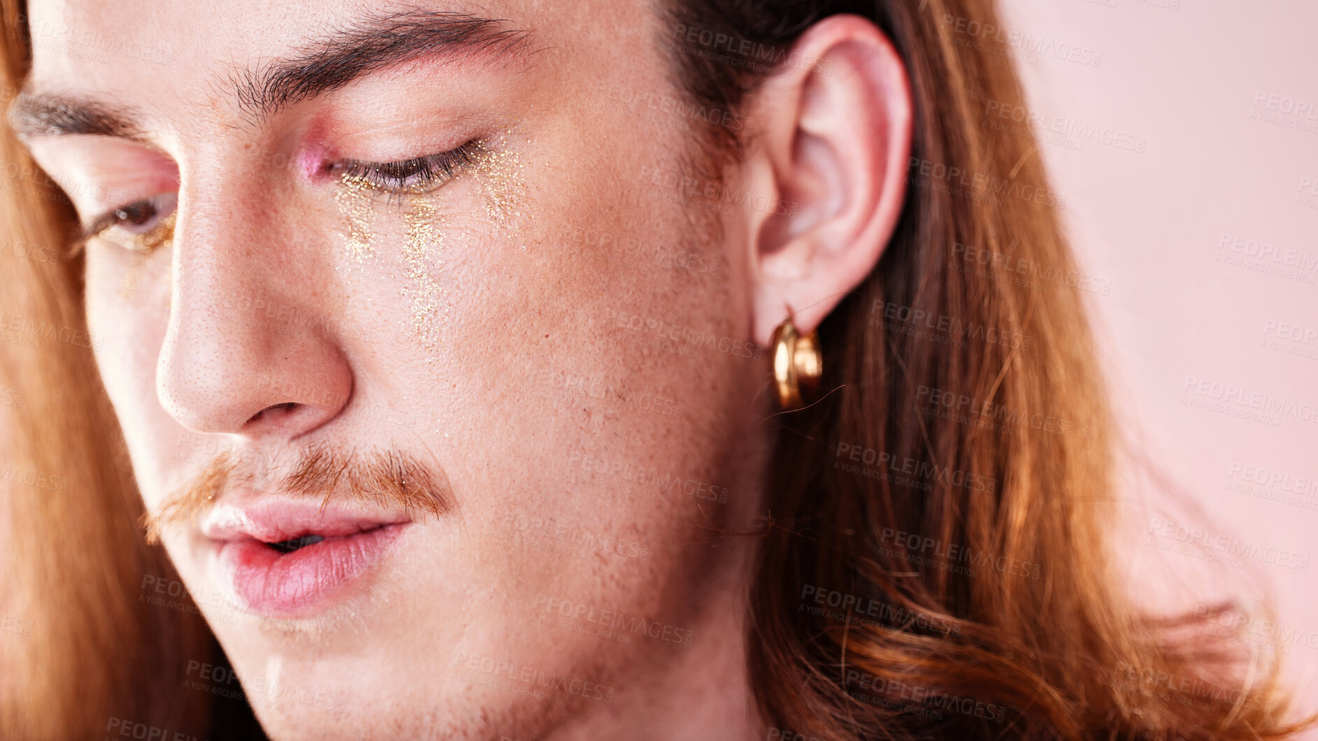 Buy stock photo LGBTQ, makeup and gay man in a studio with a cyberpunk, androgynous and natural aesthetic. Creative, cosmetics and young queer male model with a cosmetic, glow and beauty face by a pink background.