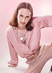Portrait, vintage fashion and lgbt man from Ukraine with confidence isolated on pink background. Happy, aesthetic and male model with beauty in studio, creative non binary and gender neutral design.