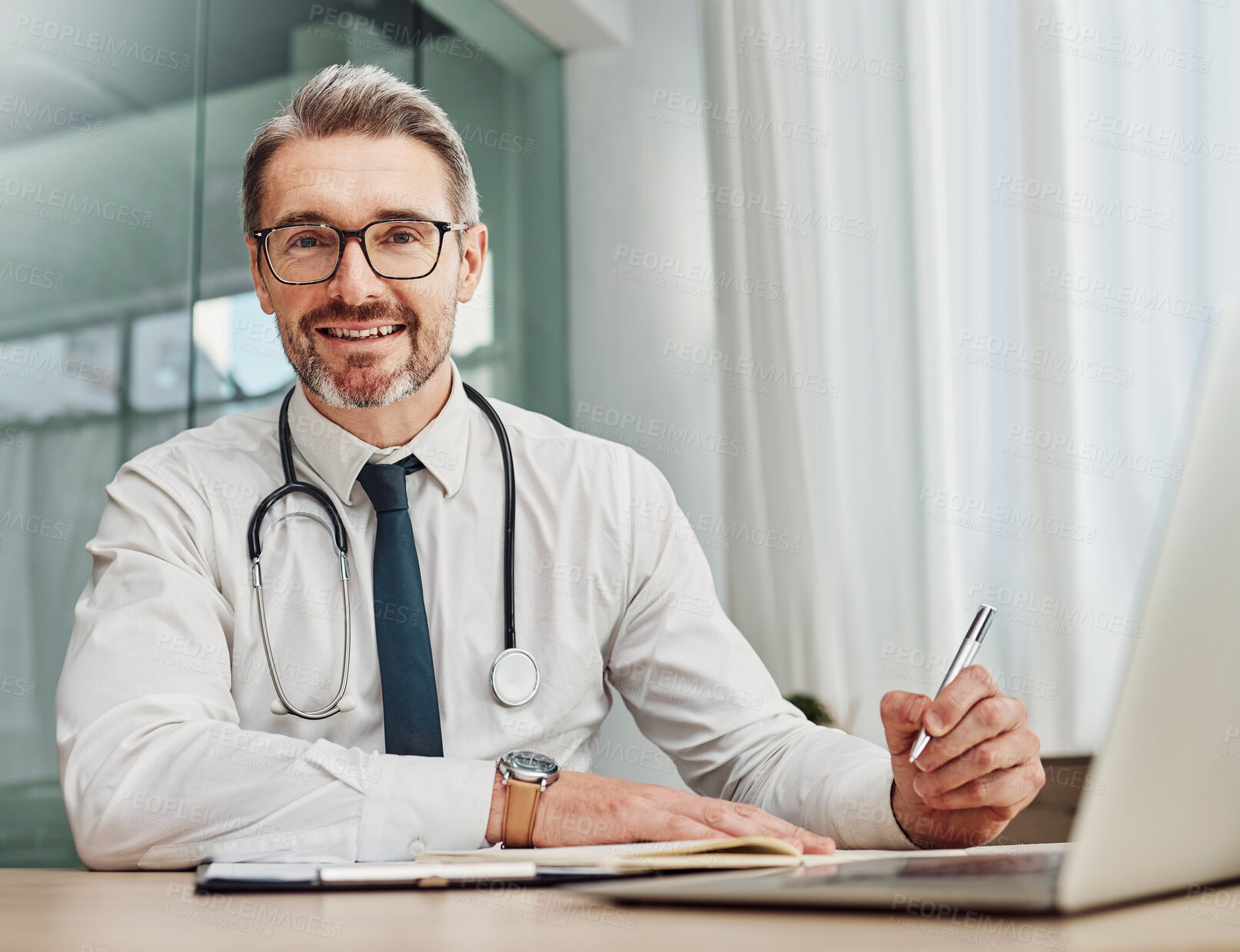 Buy stock photo Senior doctor, writing and portrait of a hospital worker in a office doing medical research. Happiness, laptop and checklist of a wellness and health employee with a smile from clinic vision