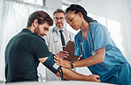 Nurse, doctor and patient with blood pressure test in hospital for heart health or wellness. Healthcare, hypertension consultation and medical physician with man for examination with sphygmomanometer
