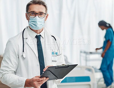 Buy stock photo Covid, leadership and portrait of doctor with clipboard, man in hospital for support in medical work. Health, insurance and medicine, mature professional with stethoscope, mask and patient chart.