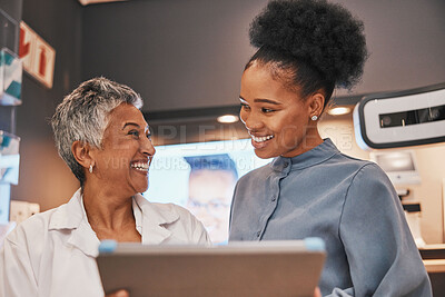 Buy stock photo Optometry, tablet and optometrist talking to a patient about eye test results or consultation. Discussion, technology and senior optician speaking to a female with a mobile device at a optical clinic