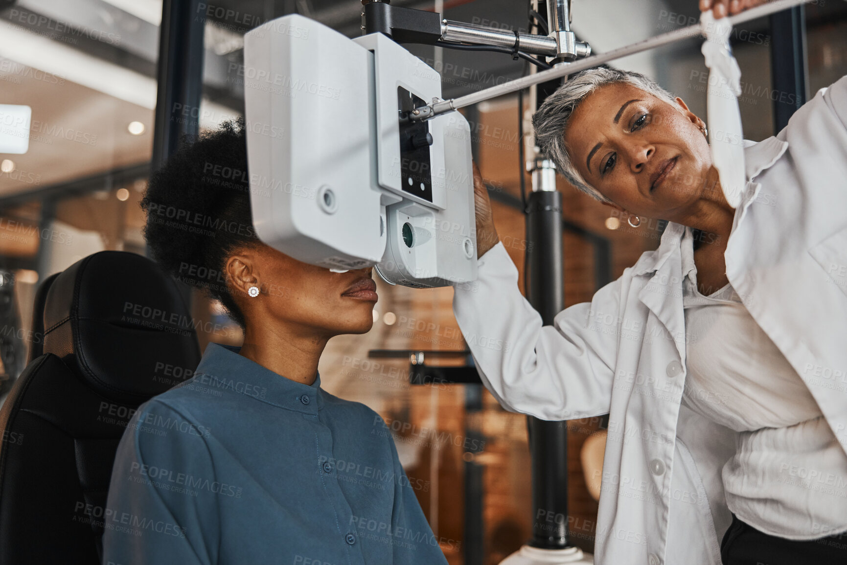 Buy stock photo Eye exam, vision and woman patient in optometry clinic for testing, eyesight and optical assessment. Healthcare, optometrist consultation and doctor use medical equipment, phoropter and lens for eyes