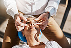 Hands, face or senior woman in eye exam for eyesight at optometrist for an assessment in office. Doctor or optician helping a mature customer testing or checking vision, iris or retina visual health 