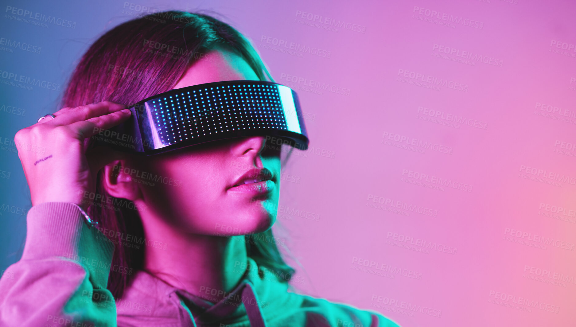 Buy stock photo Virtual reality, cyberpunk and mockup, woman in goggles in online metaverse app, game or video on neon purple background. Vr, ar and ux, future fashion digital glasses on model in studio with space.