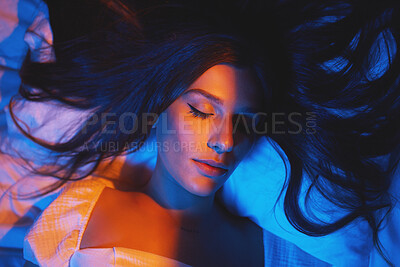 Buy stock photo Sleeping, vaporwave lights and woman with eyes closed in bedroom with creative disco lighting. Makeup, beauty and model resting and feeling relax and calm on a bed pillow with cyberpunk aesthetic 