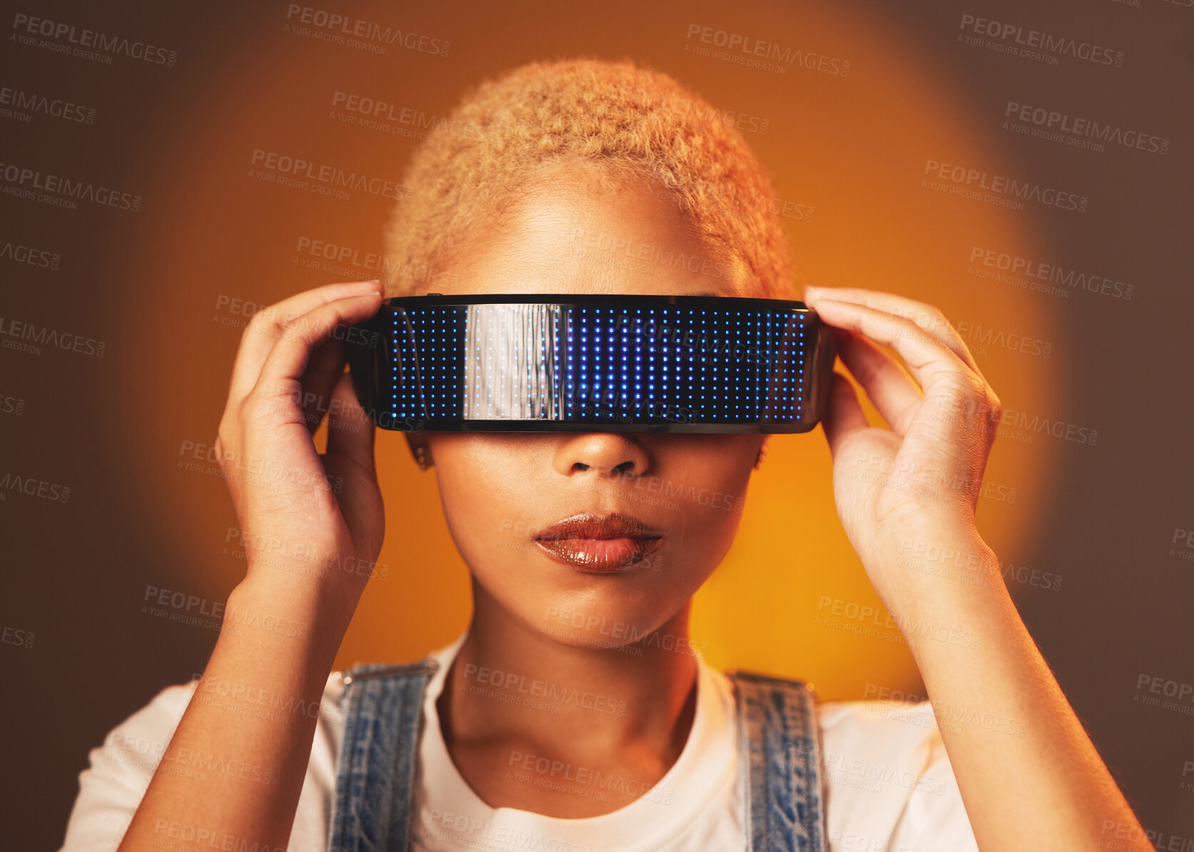 Buy stock photo Black woman, vr and futuristic cyberpunk glasses in online metaverse app or game or video on brown background. Virtual reality, future fashion and digital augmented reality goggles on model in studio